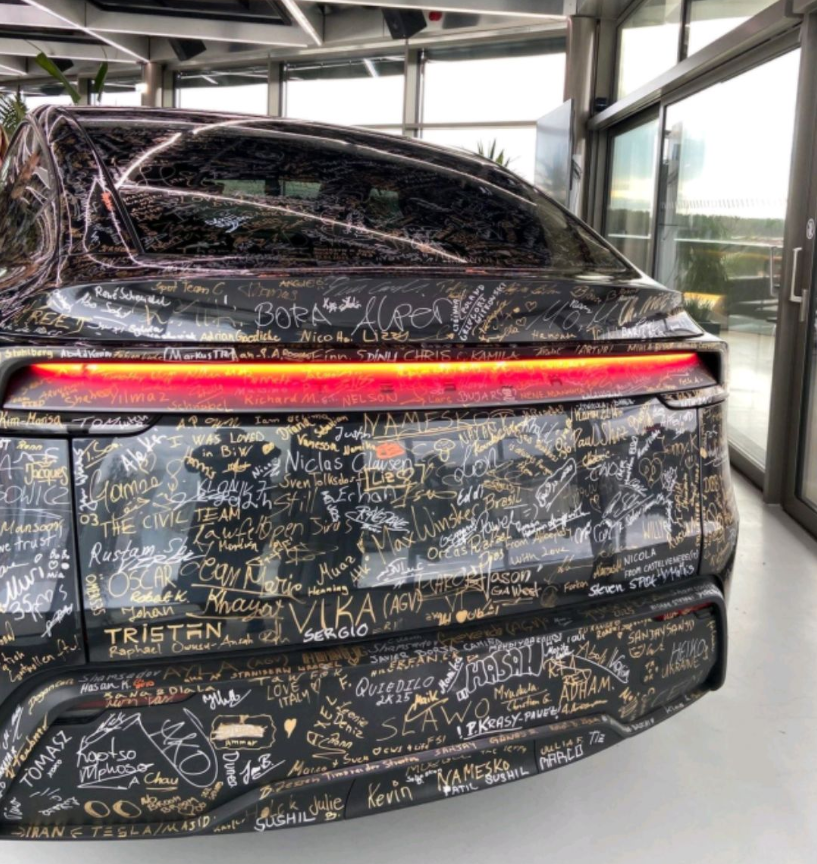 The First Refresh of the Model Y Rolls Off the Line at Tesla’s Berlin Gigafactory, Adorned with Employee Signatures